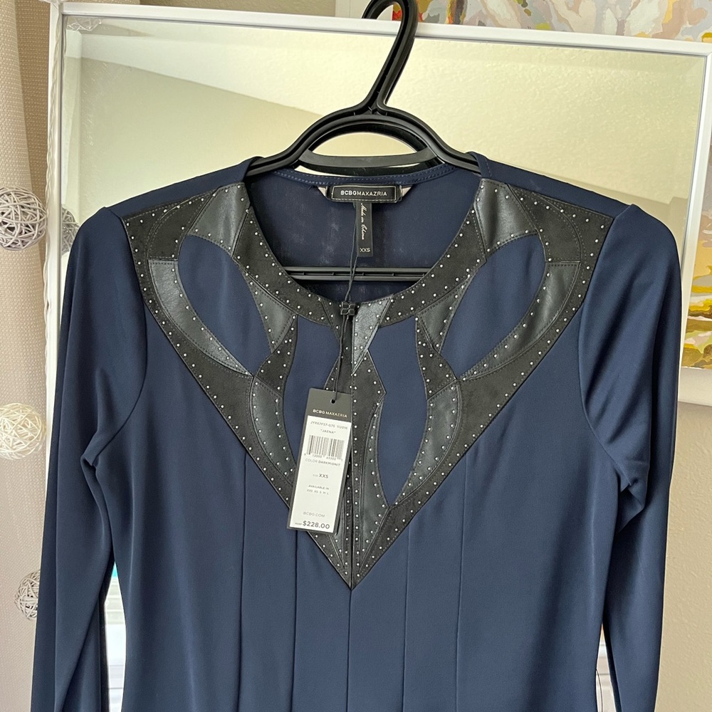 BCBGMAXAZRIA’s XXS (0-2) above the knee, longsleeve dress with a leather details